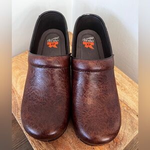 Dansko women’s Embossed Brown Slip-Ons